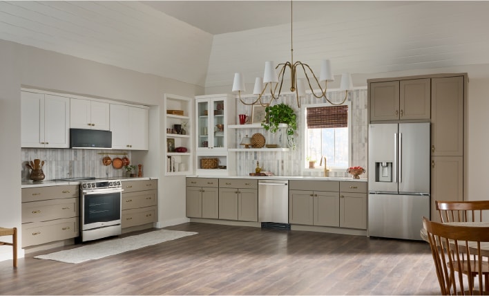 Modern kitchen featuring an LG dishwasher and stainless steel refrigerator