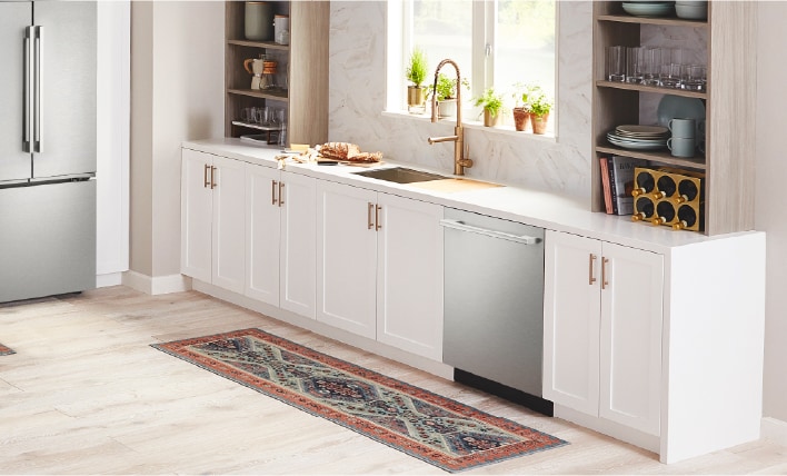 LG stainless steel dishwasher seamlessly integrated into a bright modern kitchen