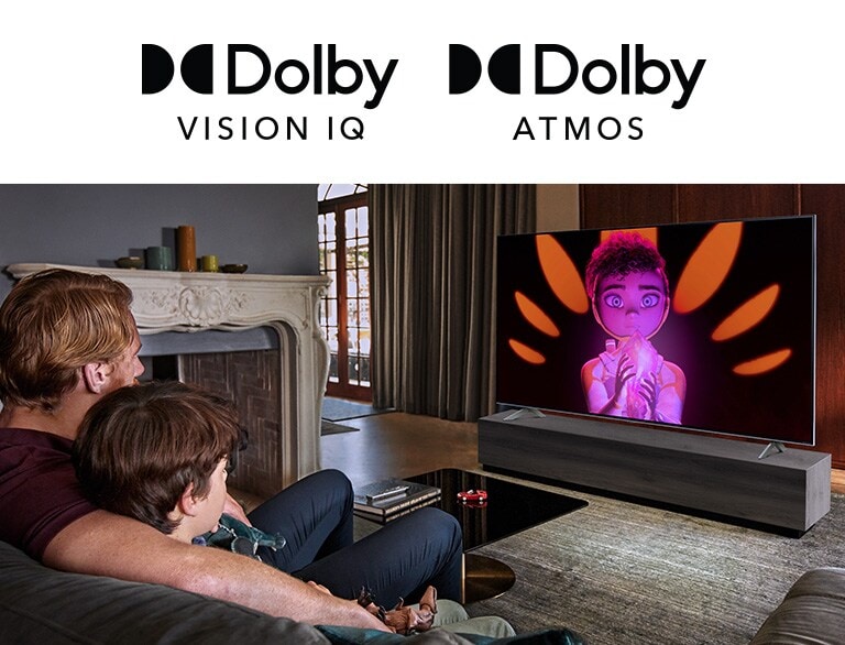 The logo of Dolby Vision IQ and Atmos are in line horizontally. Under the logos, a father and a son sitting on a couch are watching television displaying  a girl  holding a mineral in the middle of black and orange background.
