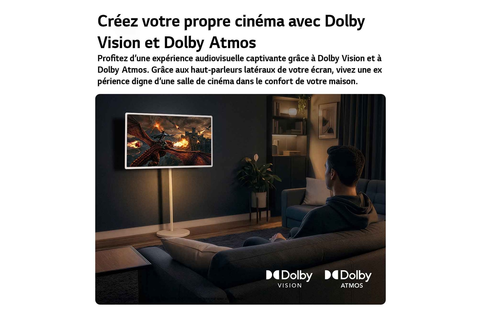 LG StanbyME 2 Max LX6 Movable Screen with Dolby Vision & Dolby Atmos shows a man watching a cinematic dragon battle in a dark room, where lifelike visuals and immersive sound create a theater-like experience at home.