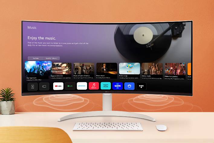 The smart monitor screen placed on the table displays the MUSIC APP screen.	