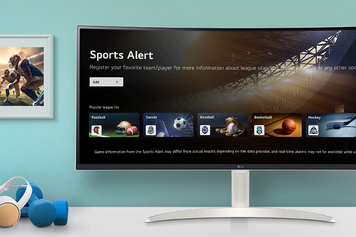 The smart monitor screen placed on the table displays the SPORTS APP screen.	