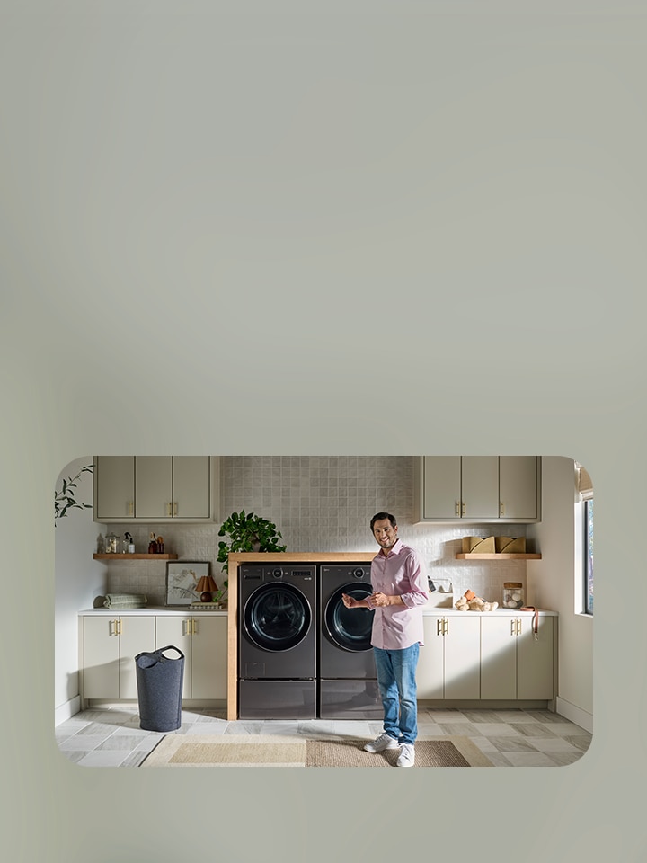 Customer stands in front of their laundry appliances
