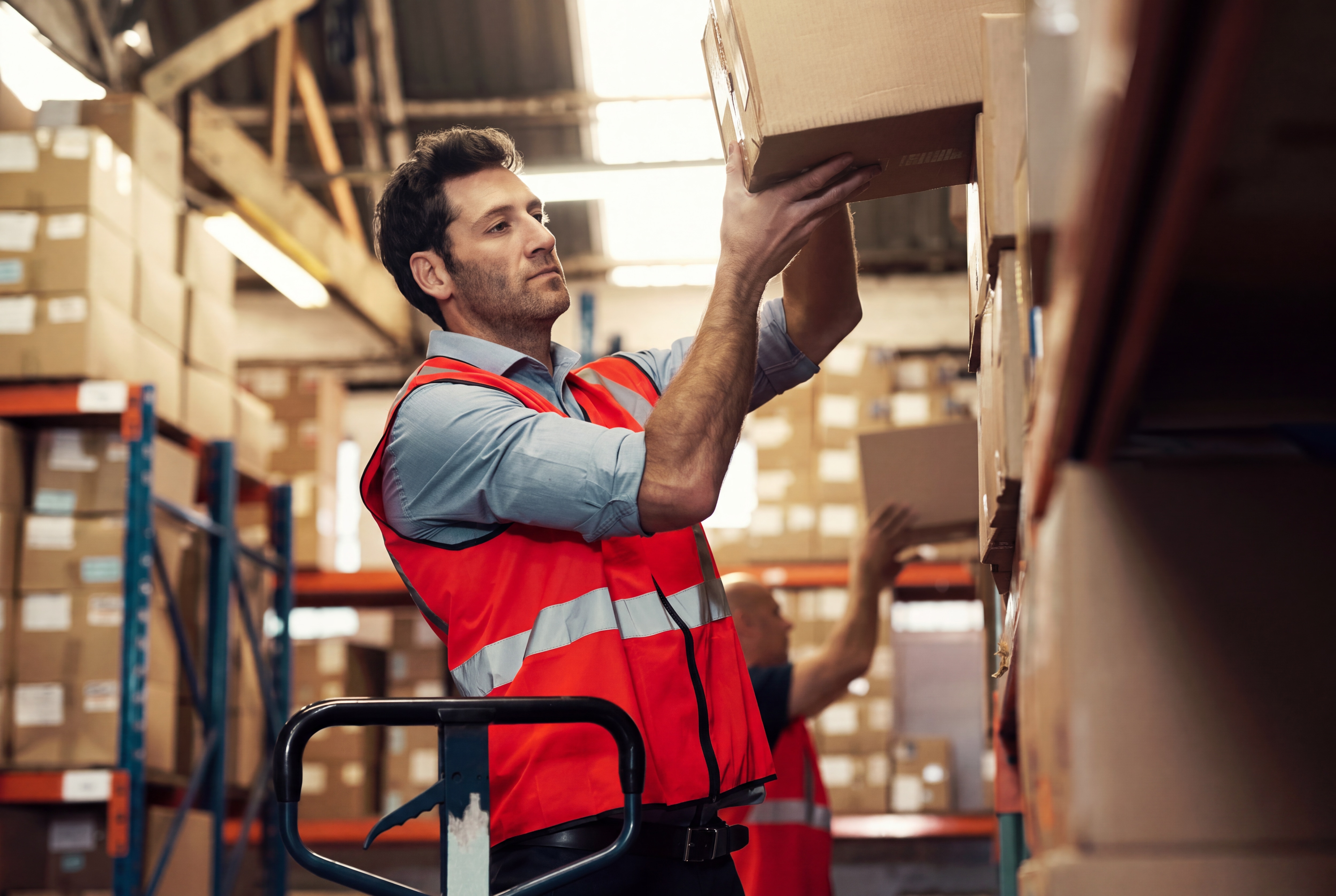 Worker busy collecting packages at the warehouse