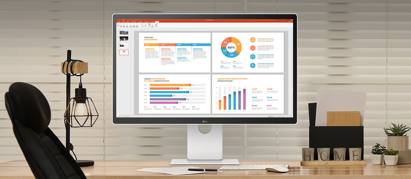 Un moniteur LG sur un bureau affichant des infographies, entouré d’un clavier, d’une chaise de bureau, d’une lampe de bureau, d’un porte-documents et de petites plantes, dans un espace de travail à domicile chaleureux.