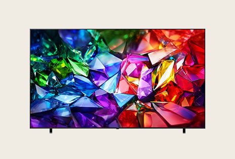 La vue de face du LG Micro RGB evo présente une mince lunette noire, avec une image cristalline et vive de facettes rouges, vertes et bleues nettement définies remplissant l’écran.