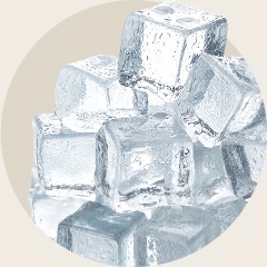 A pile of small, clear ice cubes stacked together.