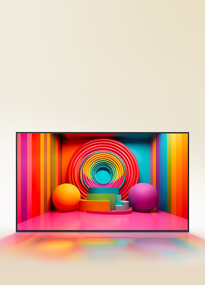 Un téléviseur UHD de LG affiche une pièce remplie de couleurs vives, de formes circulaires et de spirales sur un mur.	