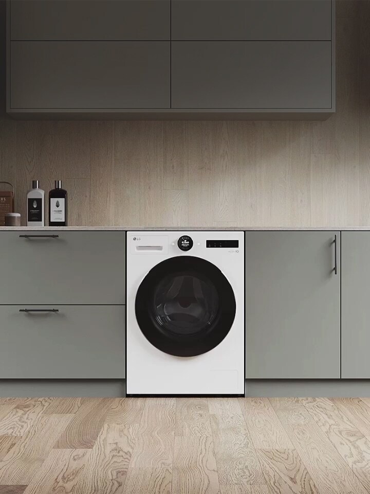 Zoom sur la machine à laver. L’écran change et le côté du panneau apparaît, montrant trois couleurs : blanc, gris clair et gris foncé.