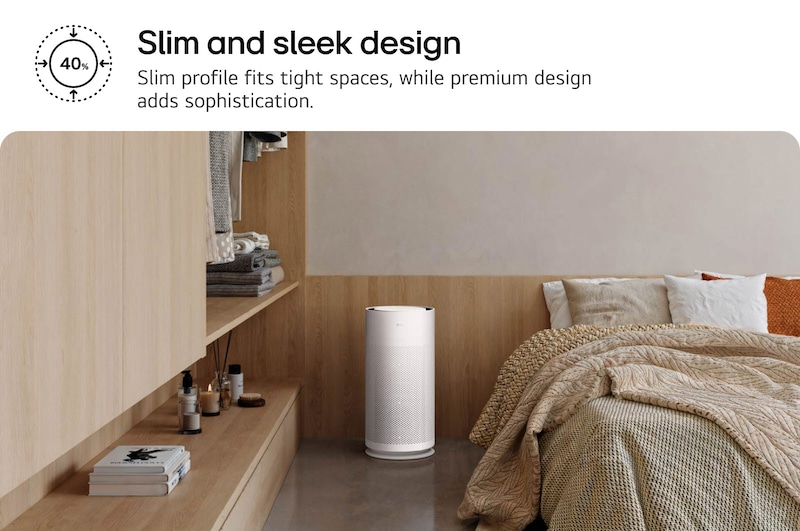 Compact white LG PuriCare™ AeroHit air purifier placed in a cozy bedroom corner beside a wooden shelf. Text reads 'Slim and sleek design: Slim profile fits tight spaces, while premium design adds sophistication'.