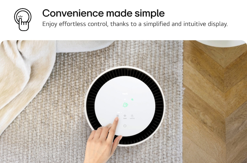 Top view of an LG PuriCare air purifier with a user’s hand interacting with the display, showing icons for settings. Text reads 'Convenience made simple: Enjoy effortless control, thanks to a simplified and intuitive display.'