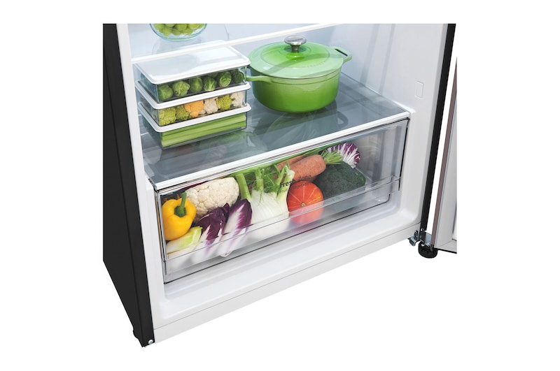 Bottom freezer view with food