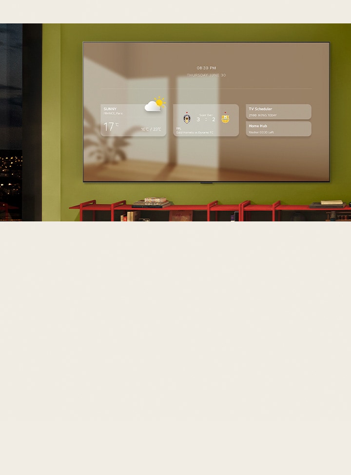 El panel informativo se muestra en una LG TV wall-mounted. Se muestran diferentes funcionalidades, desde actualizaciones meteorológicas, alertas deportivas, programador de televisión, Home Hub y Google Calendar.