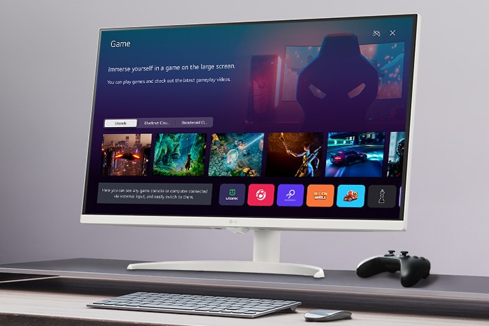 The smart monitor screen placed on the table displays the Game APP screen.	