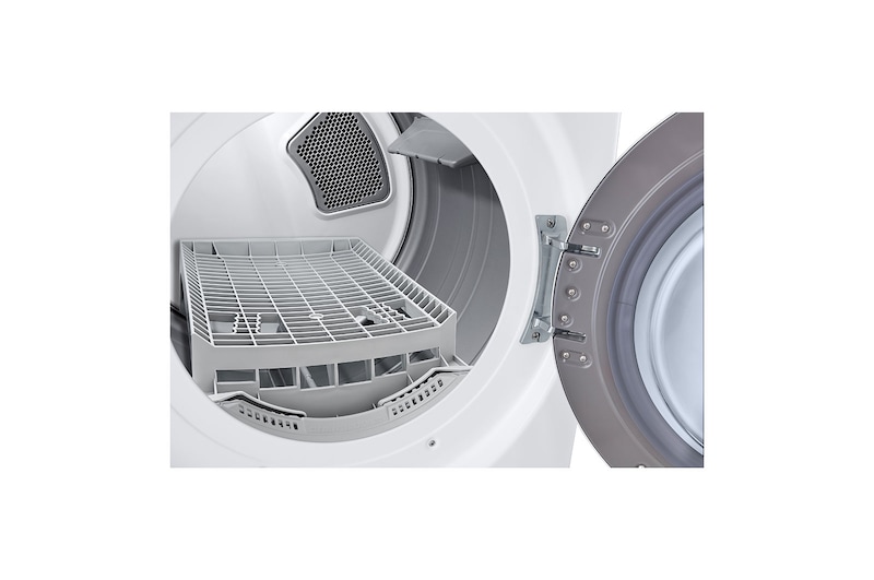 Detalle de rendijas en tanque de secadora LG, puerta abierta.