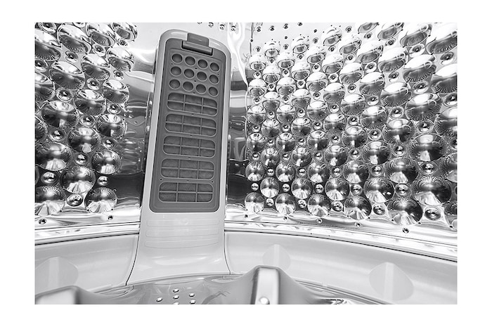 Lavadora LG wt21dv6, vista de rendijas del tanque desde dentro.