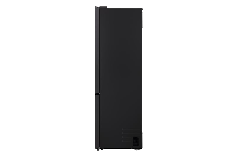 LG fridge freezer (GBBS726BEV) built into dark brown cabinetry with window and sofa on left and sink on right