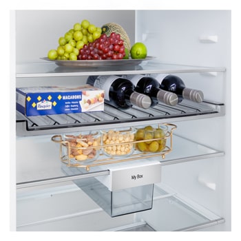 LG fridge freezer (GBBS726BEV) close up of wine rack holding four bottles and box of macarons with rack design magnified in circular image