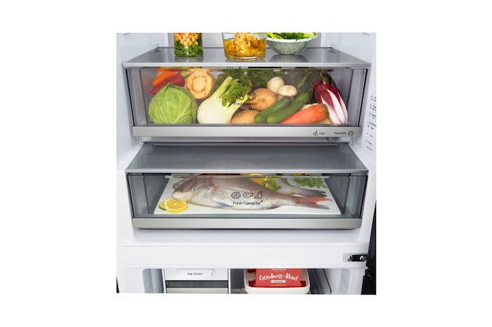 LG fridge freezer (GBBW726AEV) close up of wine rack holding four bottles and box of macarons with rack design magnified in circular image