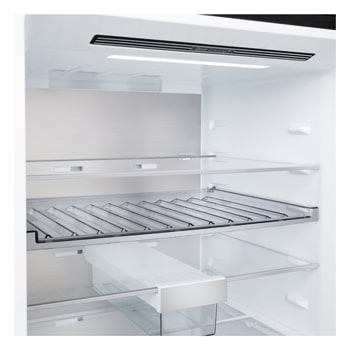 LG bottom freezer (GBBW726AEV) installed flush in tall warm beige wall with white arrows pointing to top side and front surfaces