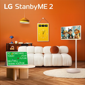 LG StanbyME 2 screens displayed in a modern living room. There is a StanbyME 2 on a stand, one is hung on the wall, and the other is propped up on a table using the folio cover.