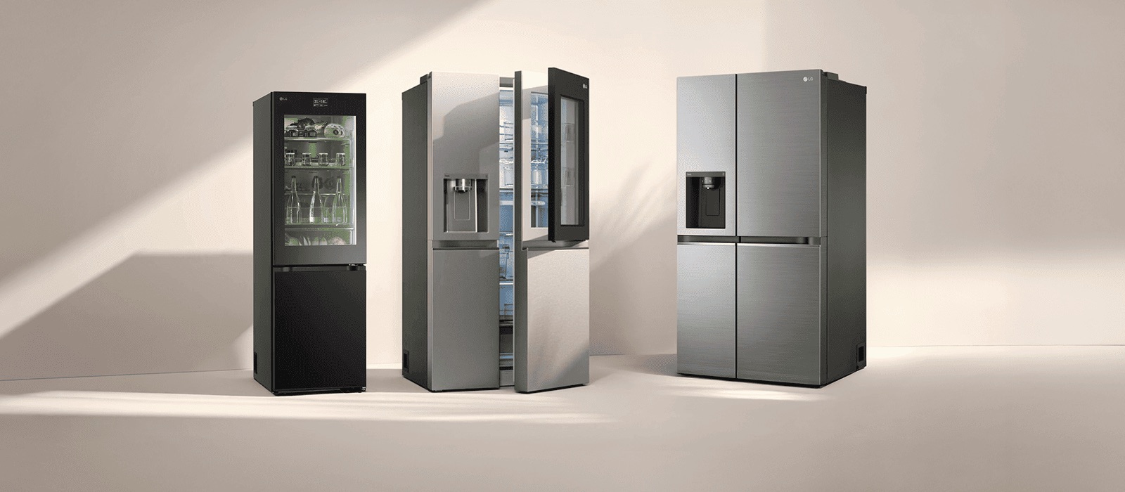 Three LG fridge freezers in sunlight. The left slim fridge has a transparent door with green-lit shelves inside. Next to it are Multi-Door and American Style models.