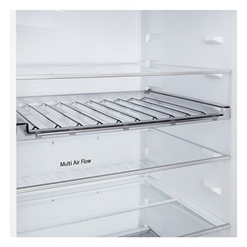 LG Unterer Gefrierschrank (GBBS726CPY) bündig installiert in hoher warmer beigefarbener Wand mit weißen Pfeilen, welche auf die Oberseite und die vorderen Oberflächen zeigen