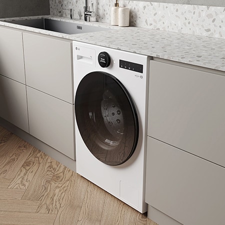 Die weiße LG 9 kg Waschmaschine F4WX809YC, installiert in einer modernen Küche, um ihr schlankes, integriertes Design zu zeigen, mit Energieeffizienzklasse A-20%.