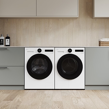 Der weiße LG 9 kg Trockner RT90X8C, als Paar neben einer passenden Waschmaschine in einem modernen Waschraum installiert, mit Energieeffizienzklasse B.