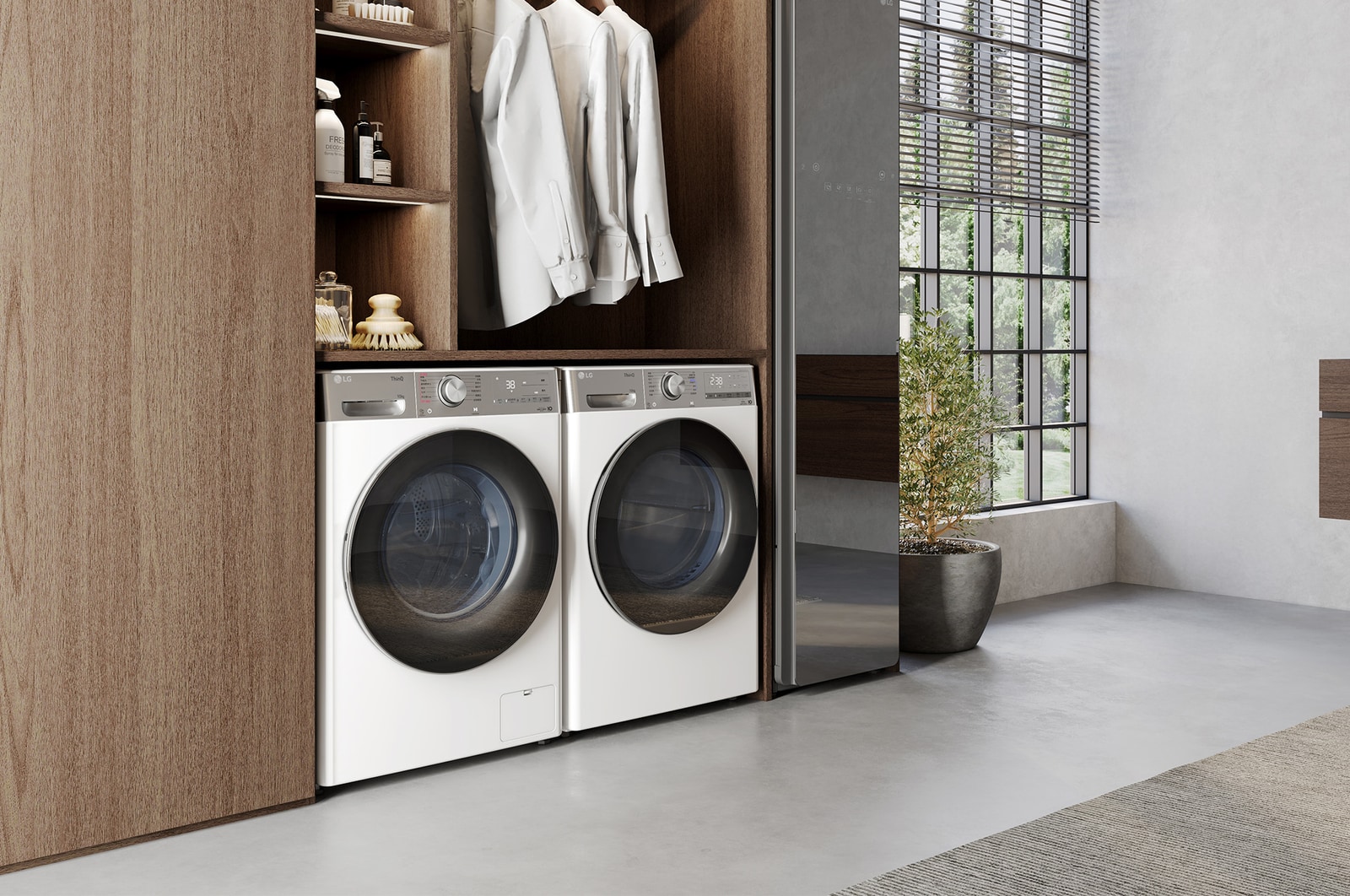 Der weiße LG 10 kg Trockner V9A2XT, als Paar neben einer passenden Waschmaschine in einem hochwertigen Ankleidezimmer installiert, mit Energieeffizienzklasse C.