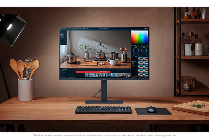 LG UltraFine 32-Zoll UHD 4K Monitor auf einem Holzschreibtisch, eingerichtet mit Kreativsoftware und Zubehör.