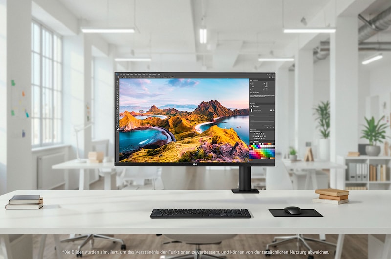 LG UltraFine 32-Zoll UHD 4K Monitor auf ergonomischem Armstand in modernem Arbeitsbereich, kombiniert hochwertiges Design mit Komfort für kreative Bearbeitung, Multitasking und effiziente professionelle Nutzung.
