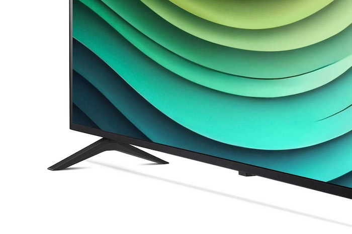 Detailansicht des Standfußes und unteren Rahmens des LG NanoCell AI NANO81 4K Smart TVs mit abstraktem grünem Muster auf dem Bildschirm.