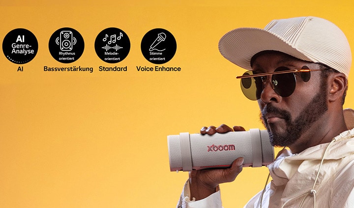 will.i.am hält den xboom Grab direkt neben sein Gesicht.