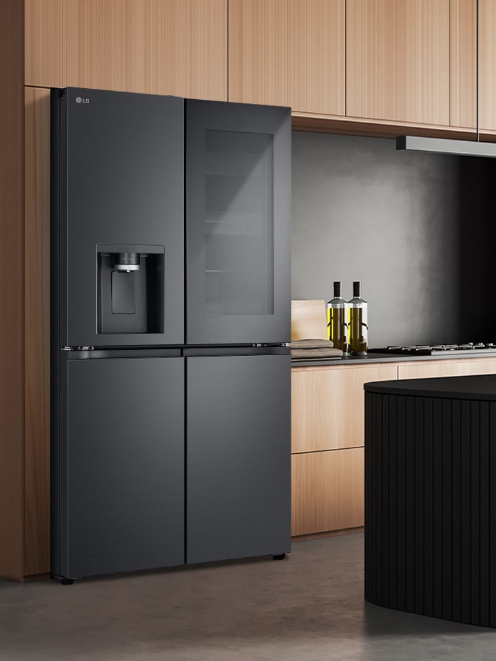 lg multi door refrigerator with instaview feature placed in a modern kitchen.	