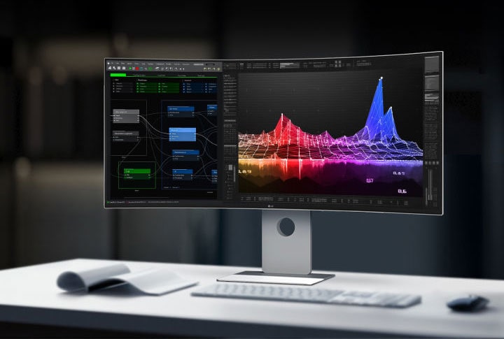 LG UltraFine Monitor auf einem Schreibtisch, der farbenfrohe Datenvisualisierungen und Codierungsschnittstellen in einer modernen Büroumgebung anzeigt.