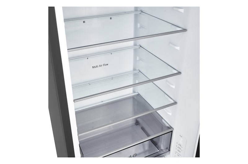 LG fridge freezer (GBBS726CEV) close up of wine rack holding four bottles and box of macarons with rack design magnified in circular image