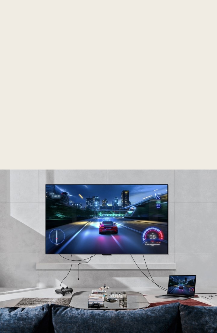 LG SIGNATURE OLED M4 mounted on a living room wall and a games console and laptop connected by messy wires across the room. The console and laptop fade out, then fade in neatly organised with a Zero Connect Box on a table. A red Wi-Fi signal appears and a red beam emits towards the TV and red circles eminate.