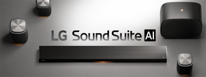 Draufsicht auf das räumliche Audiosystem der LG Sound Suite auf einer mattsilbernen Oberfläche mit Lautsprechern, Subwoofer und kabelloser Soundbar.