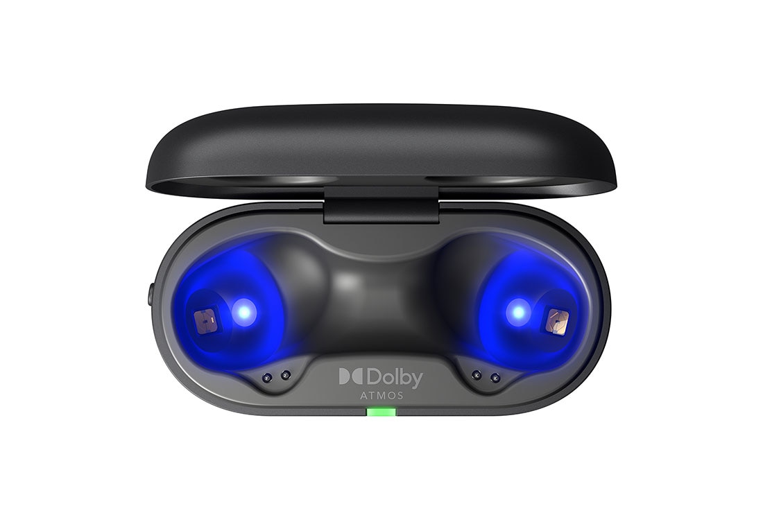 The earbuds float in the air above the open cradle with the light on.