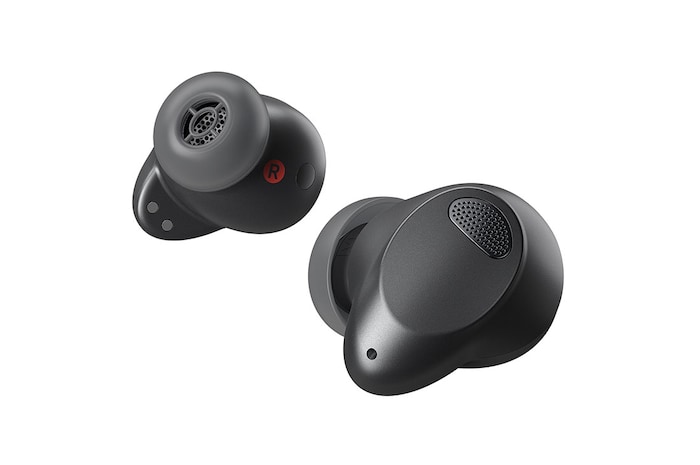 An aerial view of the open cradle, showing light coming out through the earbuds inside.