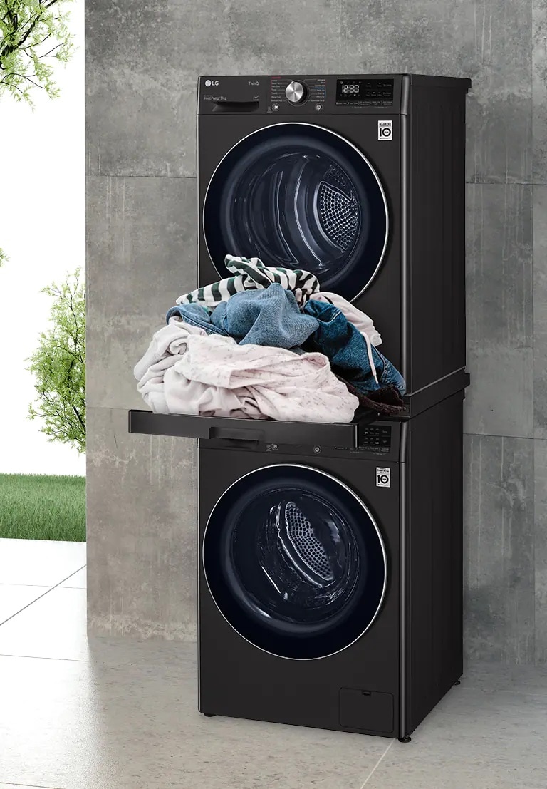 DK2B in-between LG Laundry devices, with trey out and clothes on top