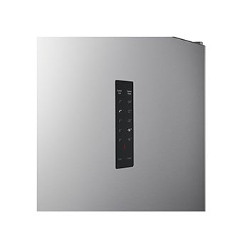 الثلاجة مفتوحة من اليمين، وتعرض الرفوف الداخلية البيضاء النظيفة