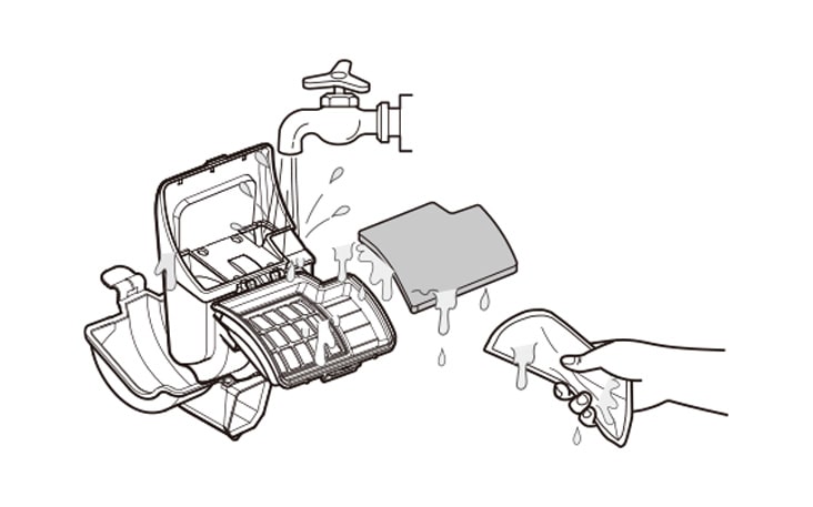 Hand rinses washing machine filter under tap, water drips from components, depicting filter cleaning process.