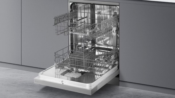LG Integrated Dishwasher with open door displaying stainless steel racks arranged inside a modern gray cabinet installation.