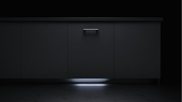 LG Integrated Dishwasher with Info Light projecting a beam onto the floor beneath the cabinet to indicate operation.
