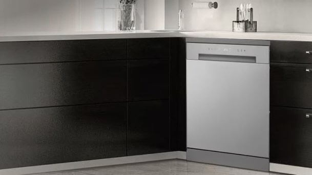 LG Integrated Dishwasher highlighting flexible installation, fitted neatly at a kitchen corner beside cabinetry under a clean white countertop.