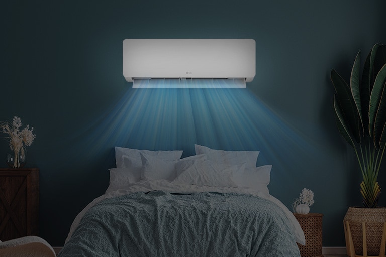  LG air conditioner installed above a bed in a cozy bedroom, releasing cool blue airflow over the sleeping area.