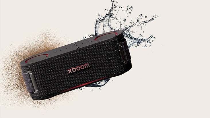 xboom Bounce is placed in a hexagonal form and behind it there's a bunch of soil on the left and splash of water on the right.
