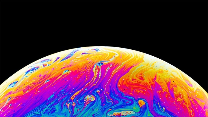 The display vividly distinguishes between the dark background and the colorful marbled hues of the scene.